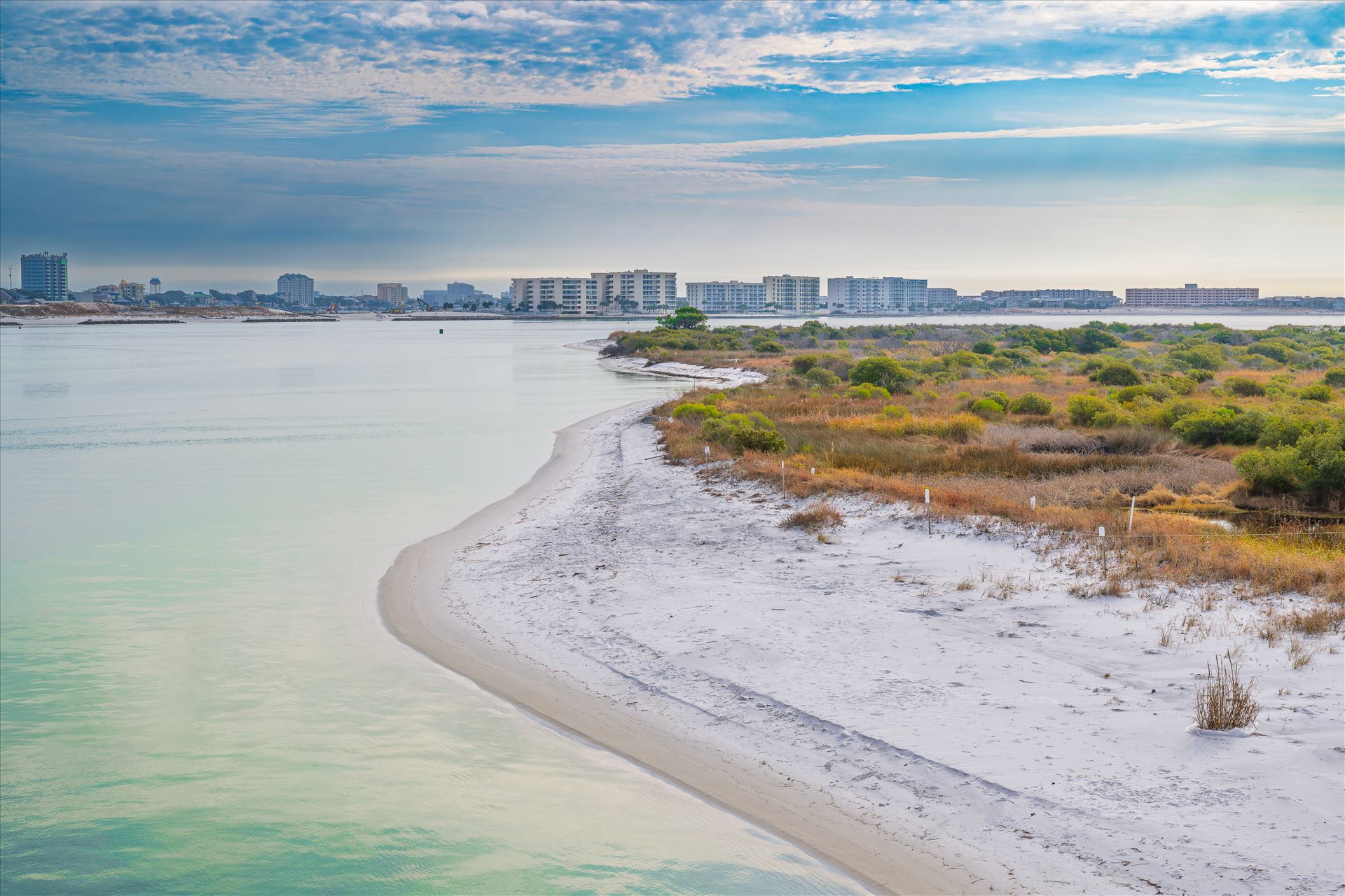 Destin Harbor Florida USA - Destin Harbor Florida USA shines under a brilliant blue sky, with fluffy clouds reflecting on the emerald-green waters, creating a picture-perfect coastal scene. by Terry Kelly Photography