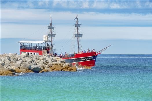 The Sea Dragon pirate ship leaving the pass rounding the jetties and entering the gulf of mexico at Panama City, Florida