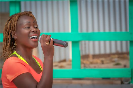 young female street performer singing. St. Maarten